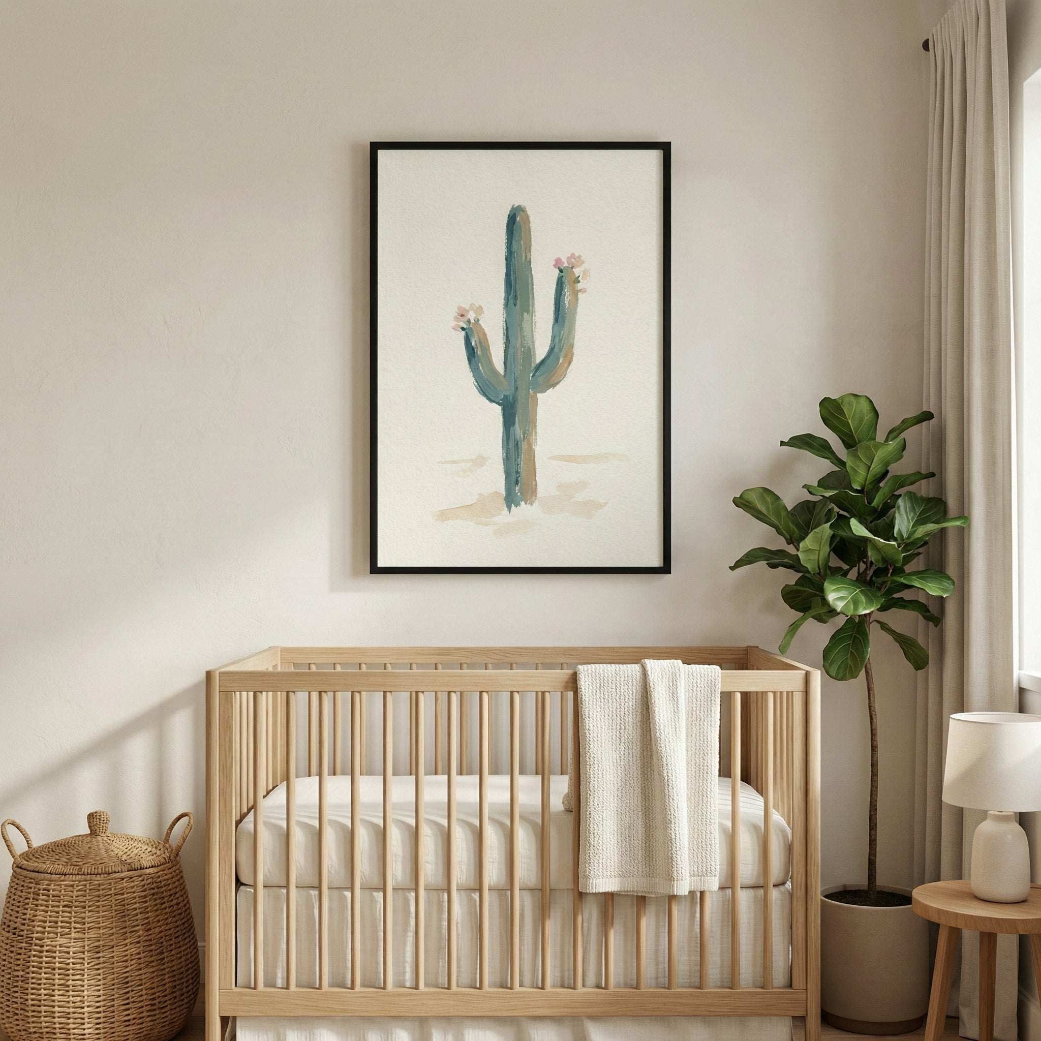 Framed cactus print with soft desert tones hanging above a wooden crib in a neutral-toned nursery. The botanical artwork adds a peaceful, nature-inspired touch to the space.