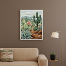 Living room with a beige sofa against a brown wall. A framed painterly desert landscape, featuring saguaro, prickly pear, agave, and flowers, hangs above the sofa. A gold floor lamp and side table with a succulent are to the right.