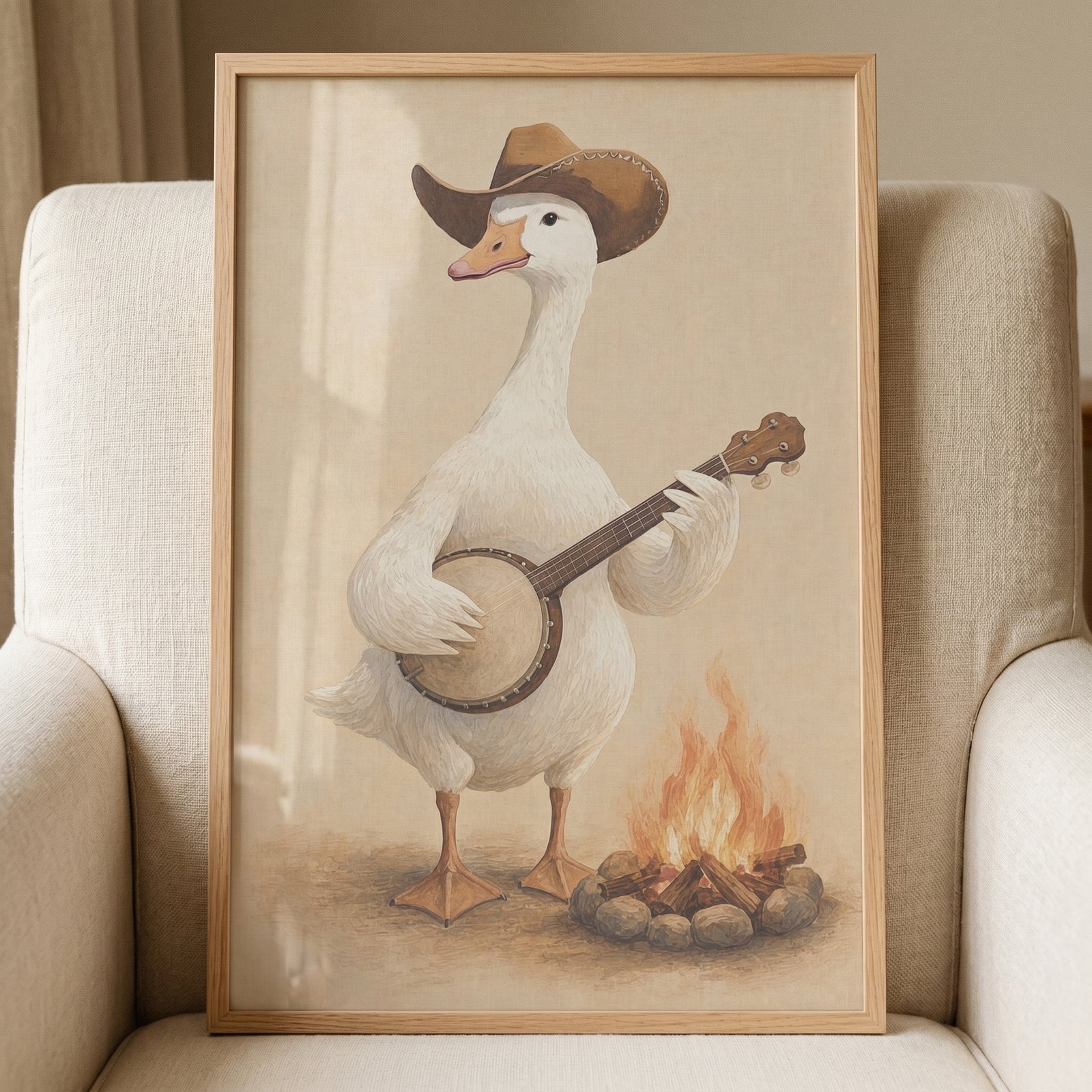 Framed campfire banjo playing goose wall art shows a white goose in a cowboy hat strumming a banjo beside a fire.
