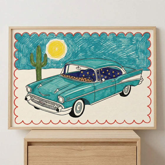 Colorful framed illustration of a vintage teal car with starry night curtains and leopard print accents, set against a desert background with a cactus and sun, bordered by a red scalloped edge.