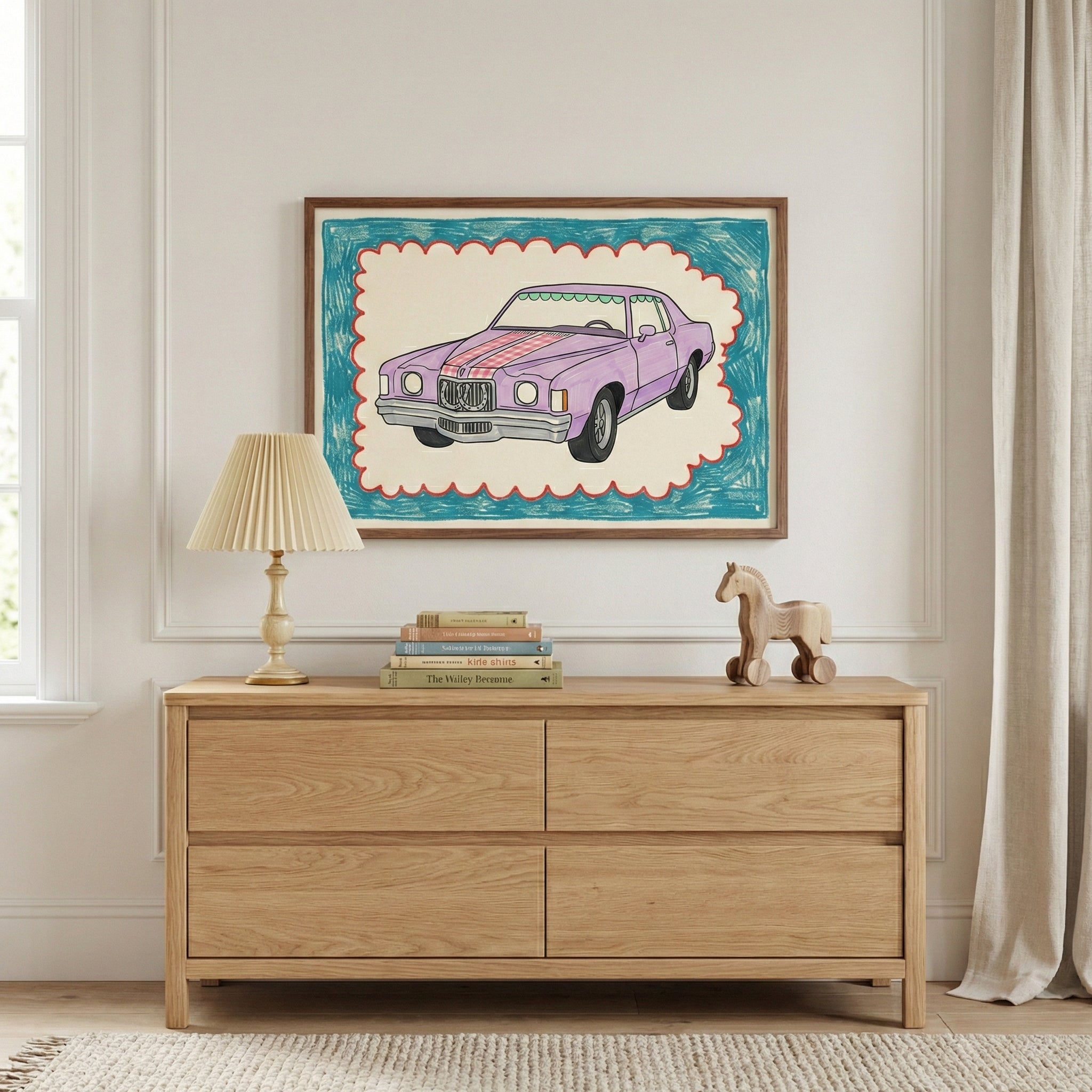 Framed drawing of a purple retro car with colorful stripes, hanging above a light wood dresser in a cozy, neutral-toned room styled with a lamp, stacked books, and a wooden toy horse.