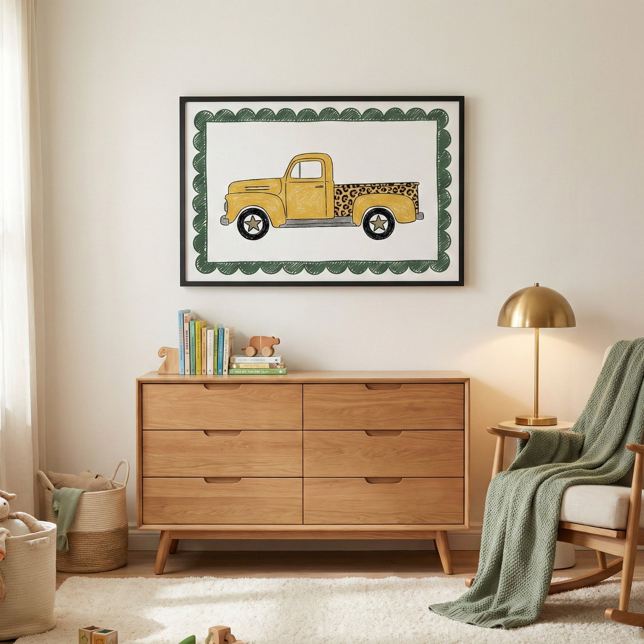 Framed artwork of a yellow vintage truck with a leopard print bed hangs above a wooden dresser in a cozy, neutral-toned nursery featuring children’s books, toys, and a green throw blanket.