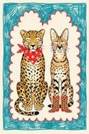 Playful illustration of a leopard and a serval sitting side by side with their eyes closed, both with pink cheeks. The leopard wears a red bandana with white stars, while the serval wears red cowboy boots. The background features a crayon-like teal and red scalloped border for a childlike, whimsical touch.