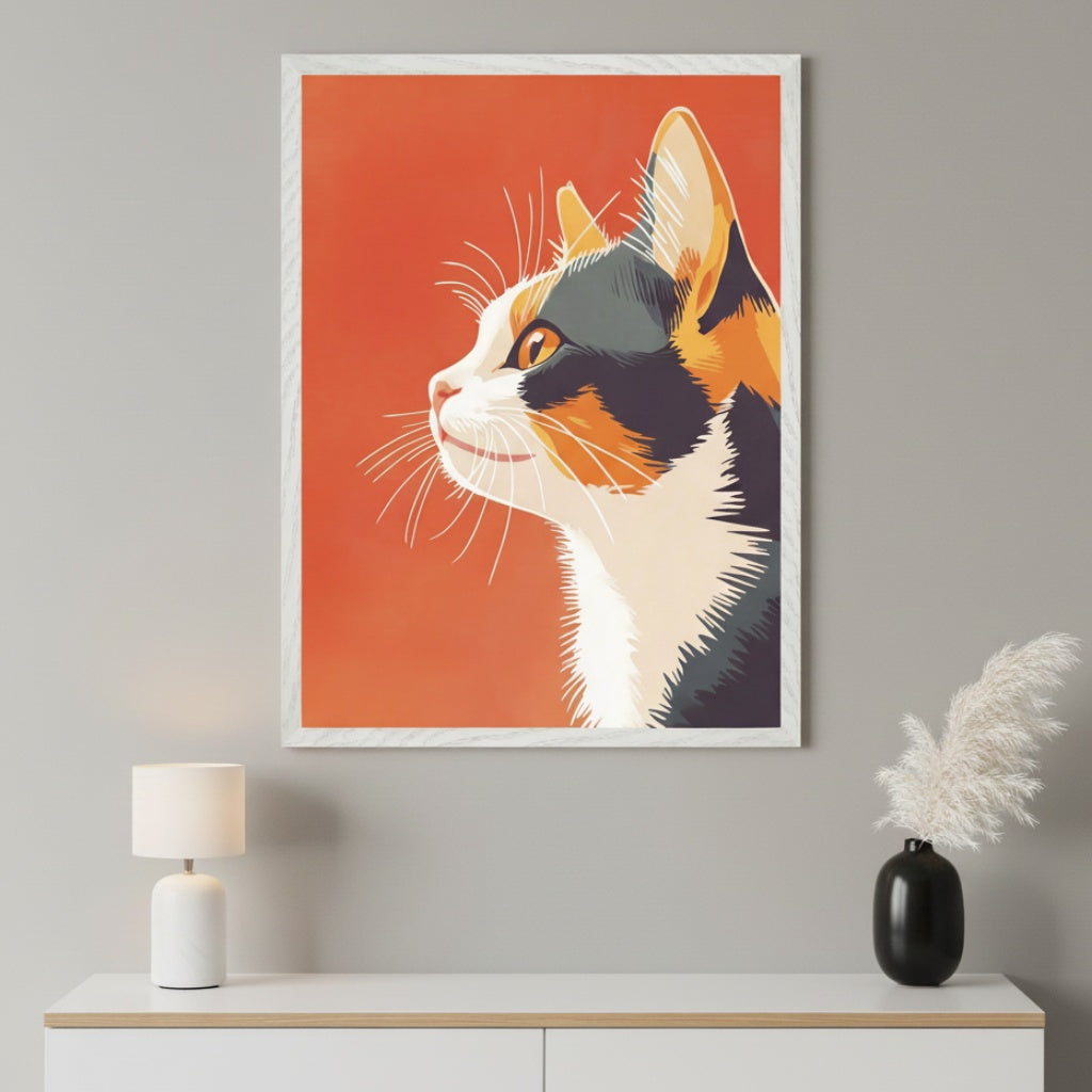Modern room with a white dresser. A framed minimalist illustration of a calico cat's profile on an orange background hangs above the dresser. A white lamp and black vase are on the dresser.