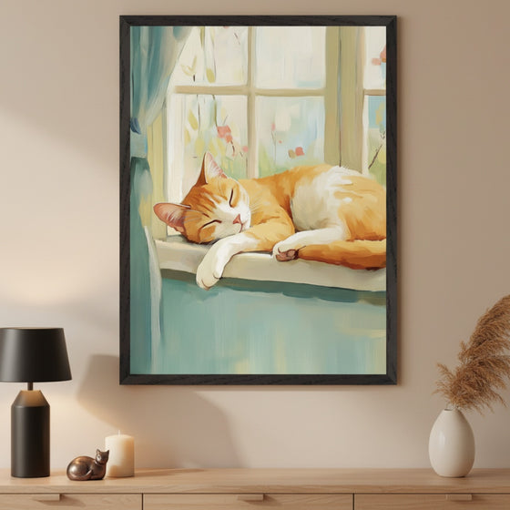 Modern living room with a light wood dresser. A large black-framed painting of an orange and white cat sleeping on a blue windowsill in a painterly style hangs centered above the dresser. A black lamp, white candle, and small cat figurine are on the dresser, with a vase of pampas grass on the right.