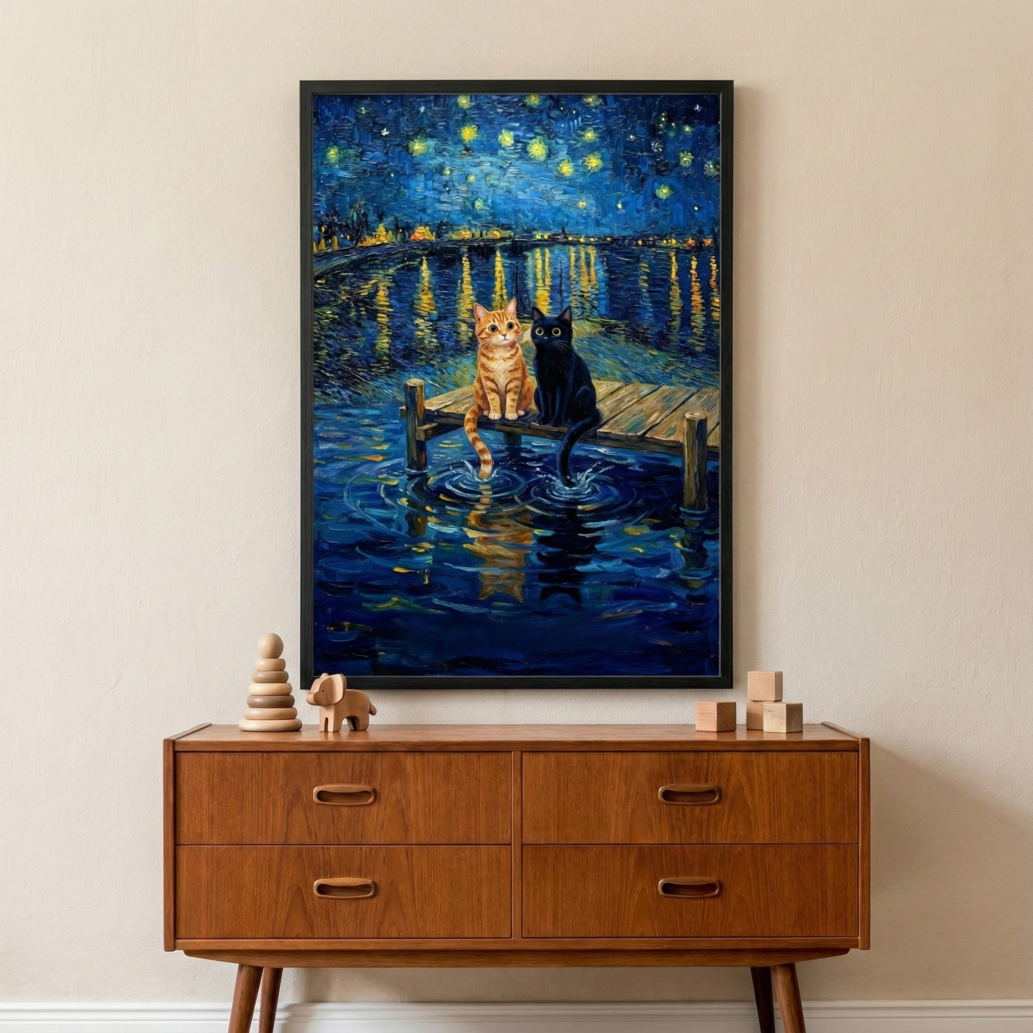 Starry night cat painting hanging above a mid-century modern console. The artwork features two cats sitting on a dock under a dreamy sky with glowing stars and shimmering water reflections, creating a peaceful nighttime atmosphere.