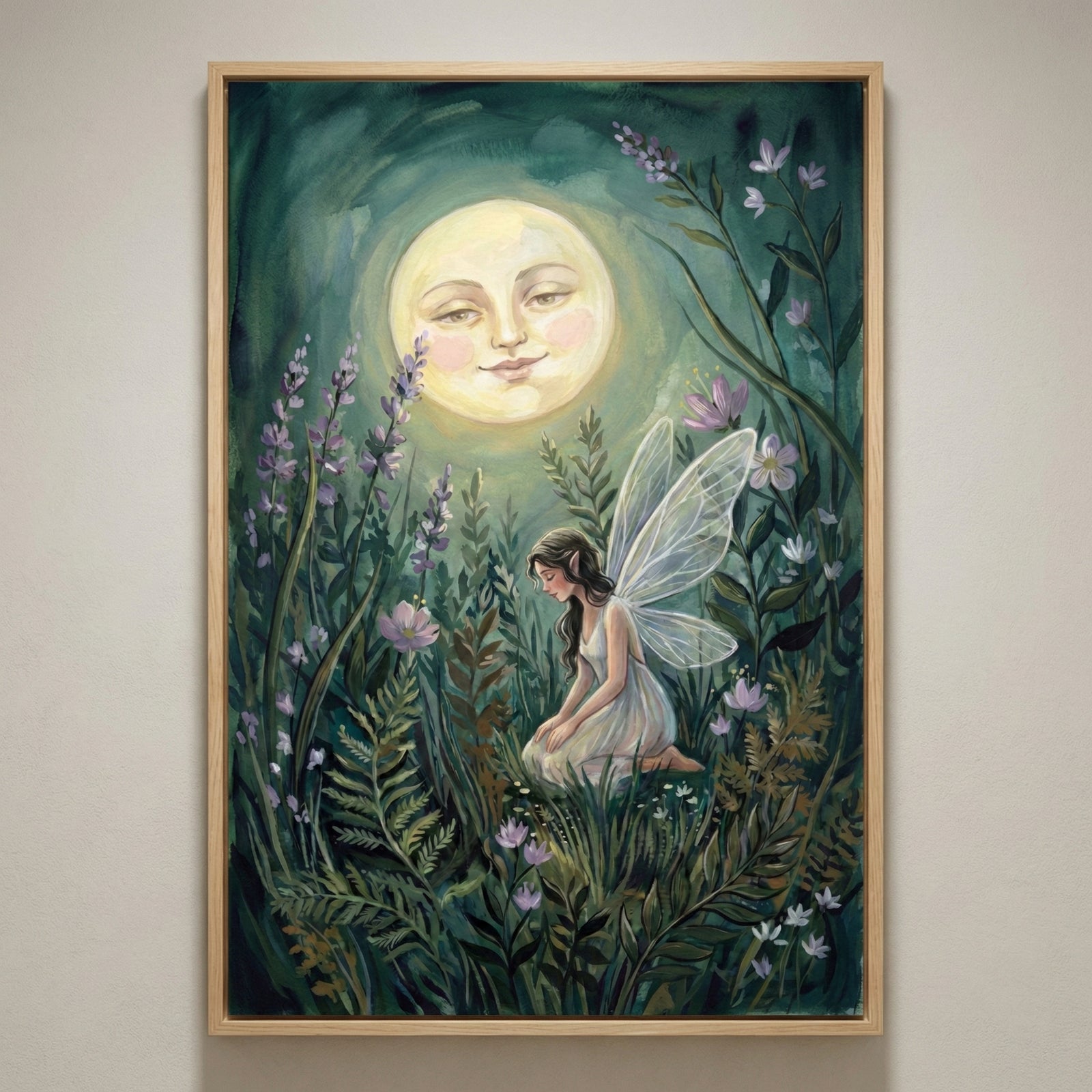 A vertical, framed piece of art depicting a whimsical night garden. In the upper center, a large, full moon with a serene human face looks down with a gentle smile. Below, a small figure with delicate, translucent wings and long dark hair sits among lush foliage, including tall stalks of purple lavender, green ferns, and small white blossoms. The entire scene is bathed in a soft, golden glow from the moon against a dark, atmospheric background.