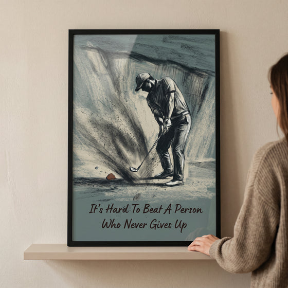 Charcoal sand trap golfer sports wall art with text: It's Hard To Beat A Person Who Never Gives Up.