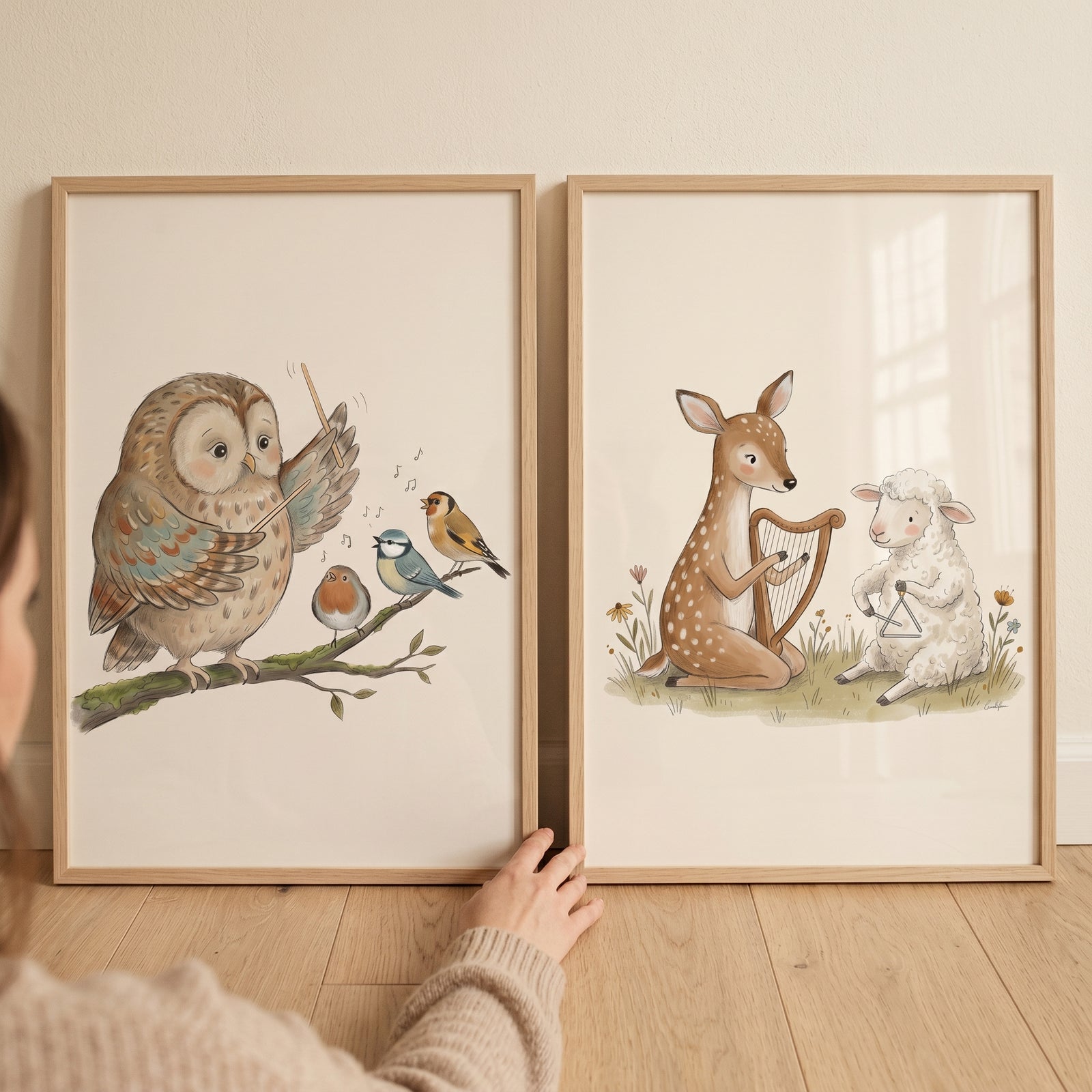 Charming illustrated animal band wall art set of 2 with an owl conducting birds and a deer and lamb playing instruments.