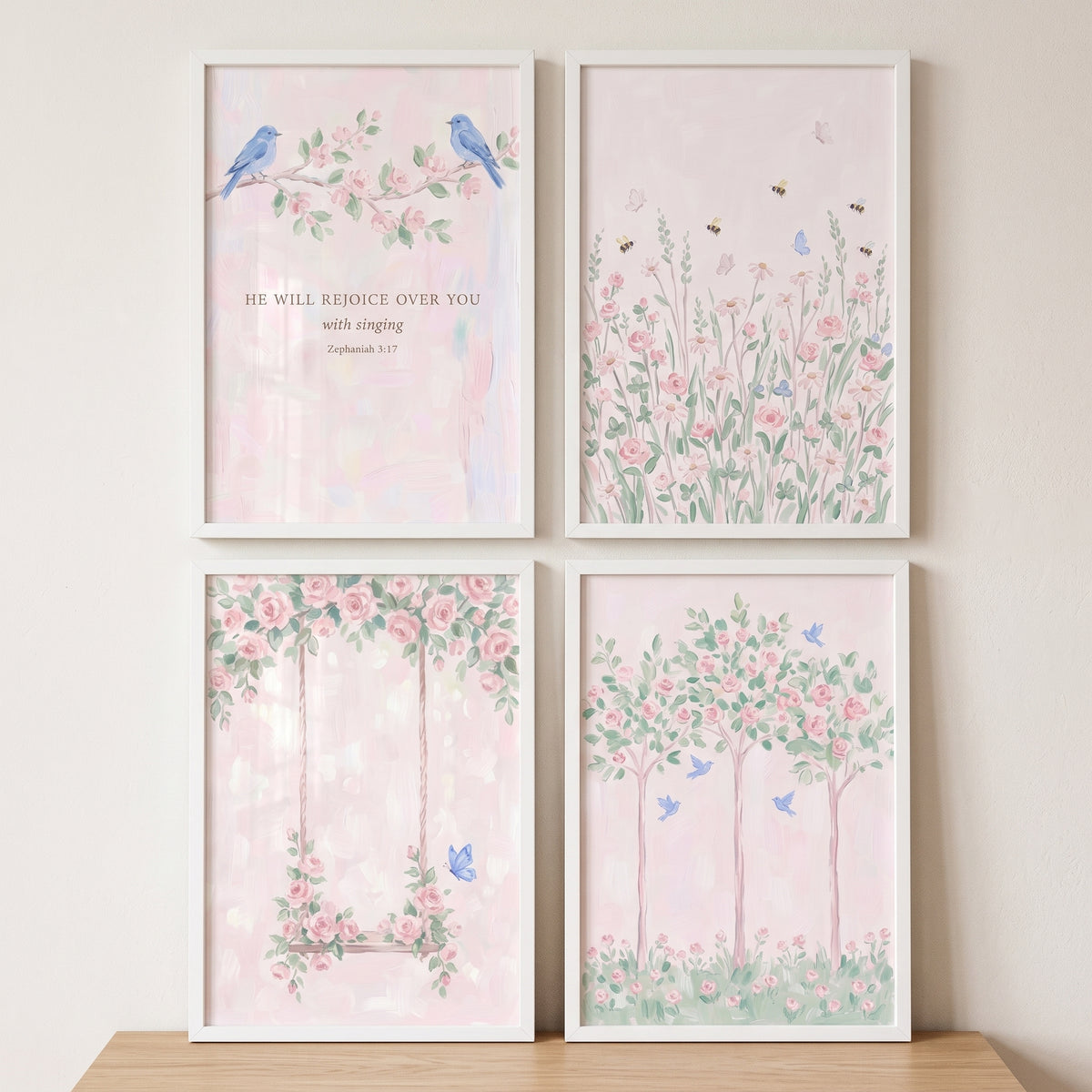 Charming pink rose garden wall art set of 4 featuring birds, flowers, and a swing in white frames on a wooden surface.