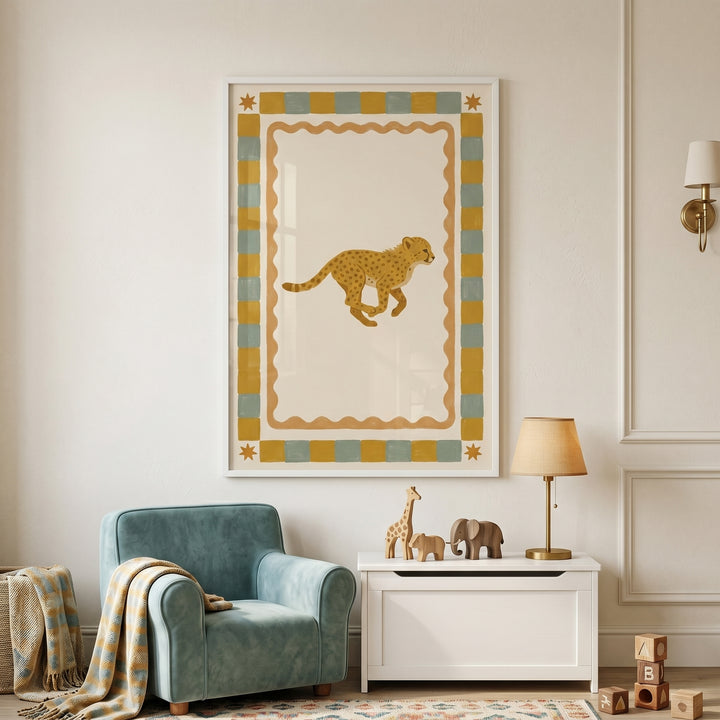 Checkered border running cheetah wall art hangs in a nursery above a white storage chest and a blue armchair.