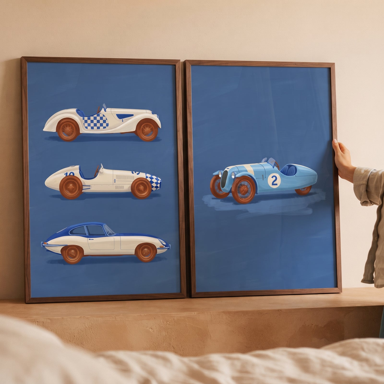 Checkered navy racing car wall art set of 2 in wooden frames, displaying four vintage cars against a blue backdrop.