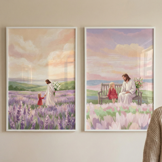 Two vertical white-framed illustrations hang on a light-colored wall. The illustration on the left shows Jesus in a long white robe walking through a field of purple lavender with a young girl in a red dress. He holds her hand while carrying a bouquet of white lilies behind his back. The illustration on the right depicts Jesus and the girl sitting on a wooden bench together in a field of light pink flowers. Both scenes feature soft, pastel skies and rolling hills in the background.
