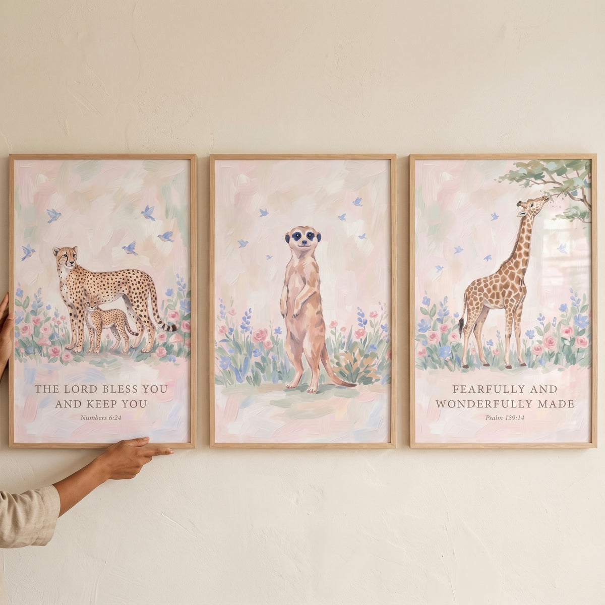 christian floral safari animals wall art set of 3 featuring a cheetah, meerkat, and giraffe with scripture verses.