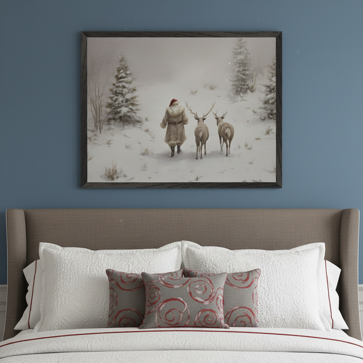 Bedroom with a brown upholstered headboard and white bedding with red accents. A large framed painting of a Santa-like figure walking with two deer in a snowy forest hangs centered above the bed.