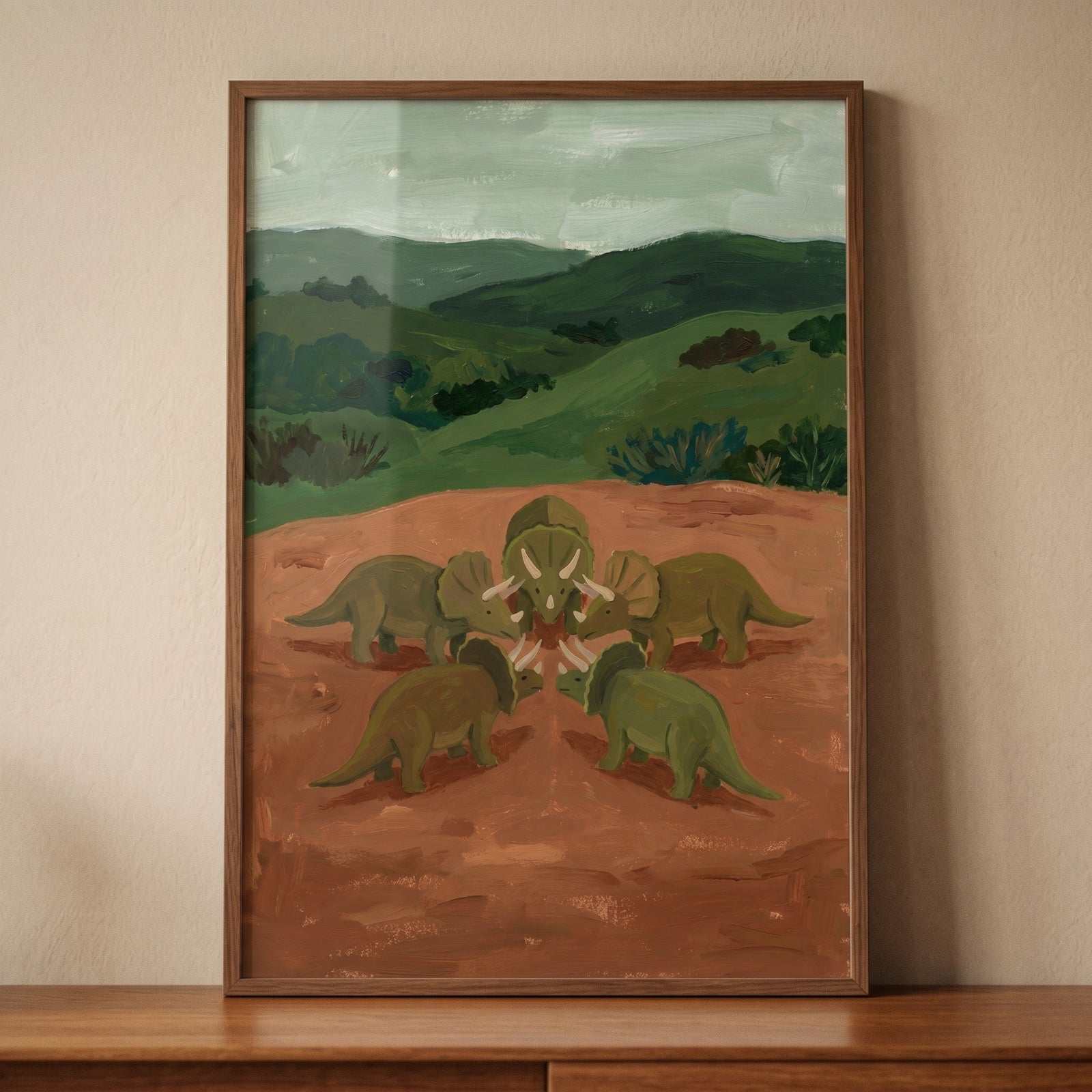 Circle five green dinosaur wall art featuring triceratops in a ring on brown earth with rolling green hills.