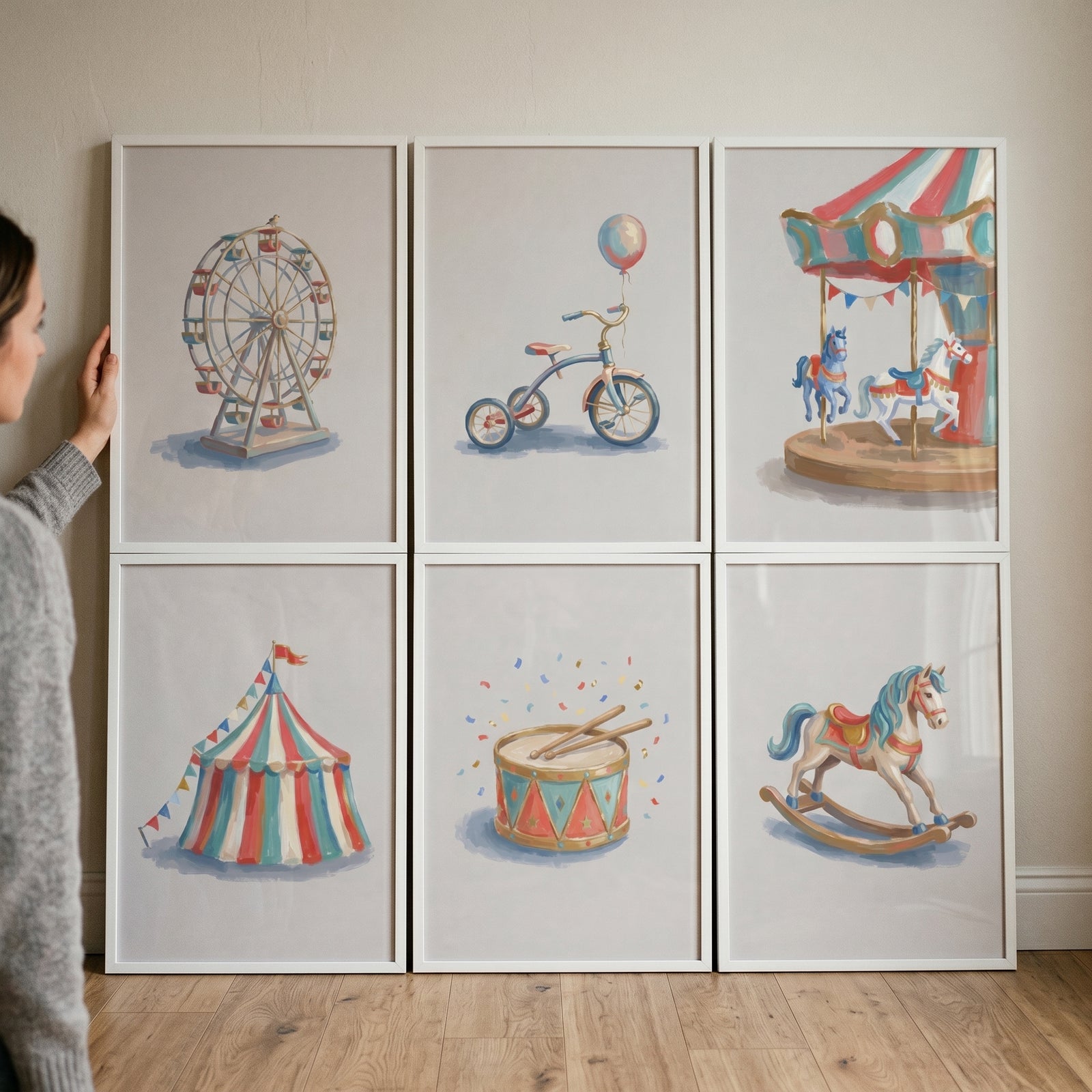 Woman holding a classic hand drawn carnival print set of 6 featuring a carousel, Ferris wheel, tent, and rocking horse.
