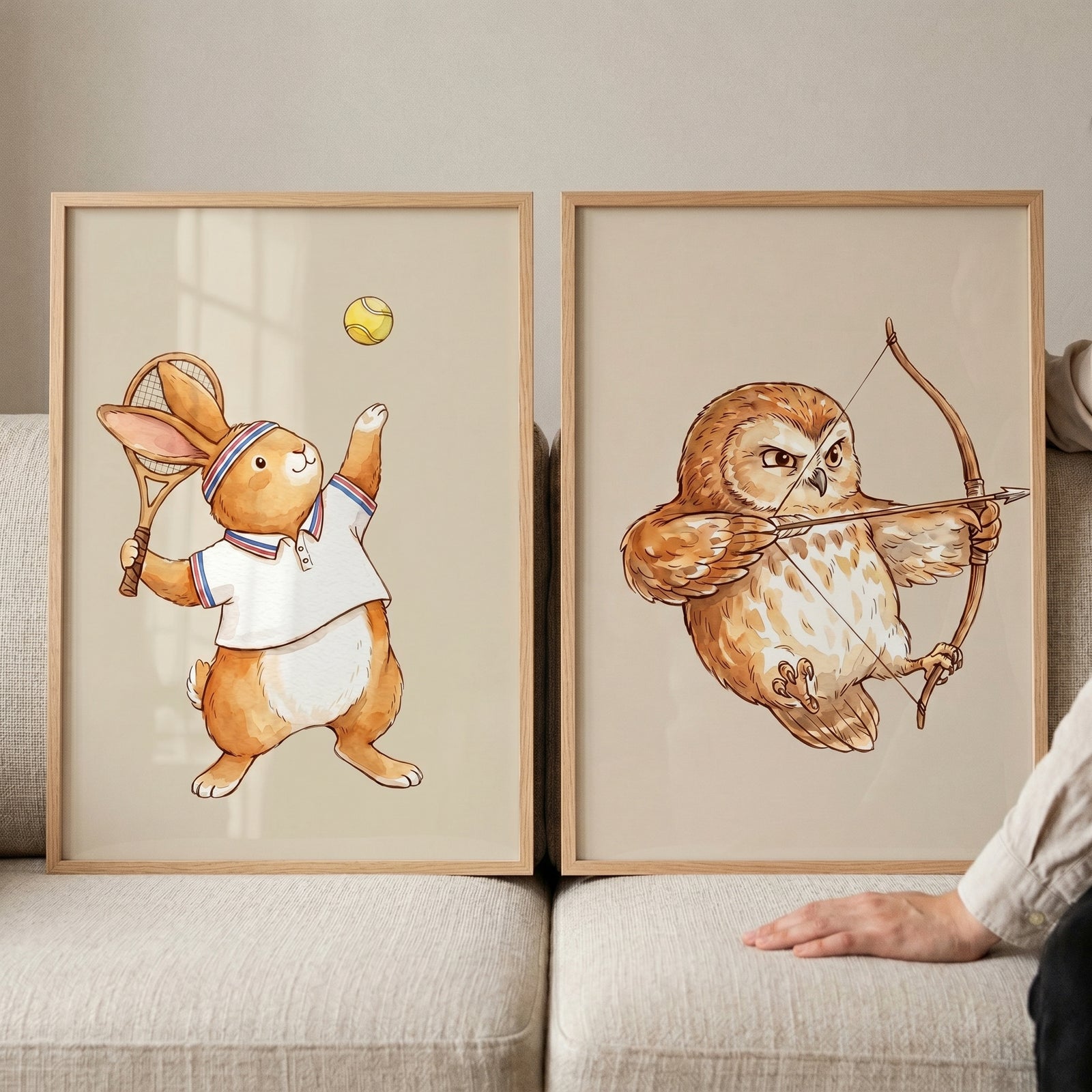 Classic storybook athletic animals wall art set of 2 with a rabbit playing tennis and an owl shooting a bow and arrow.