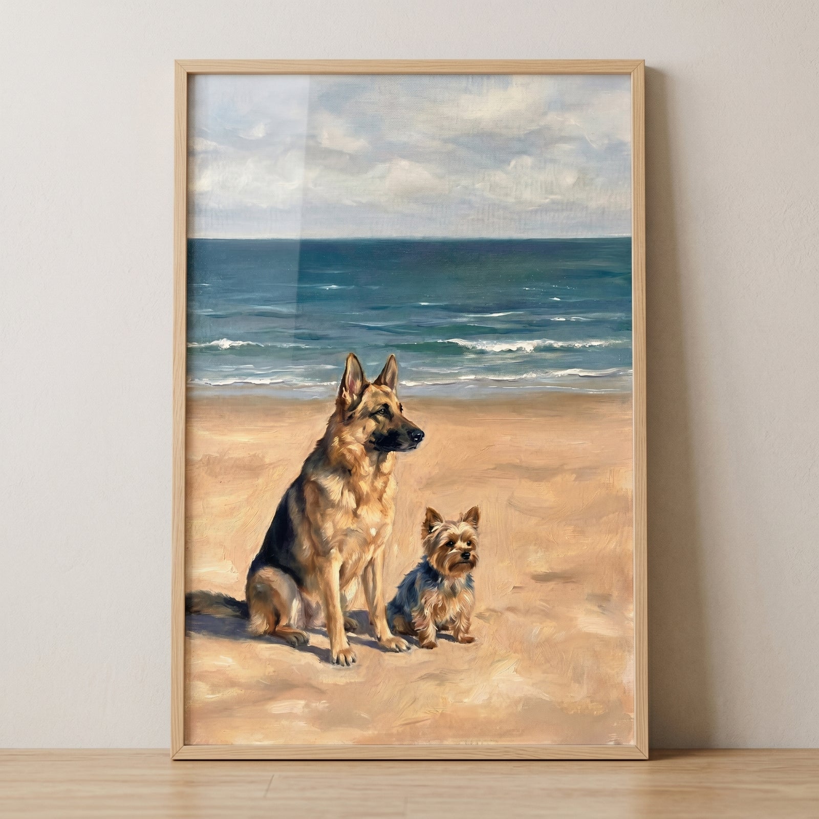 Coastal beach german shepherd dog wall art depicting a large dog and small terrier sitting on a sandy shore by the sea.