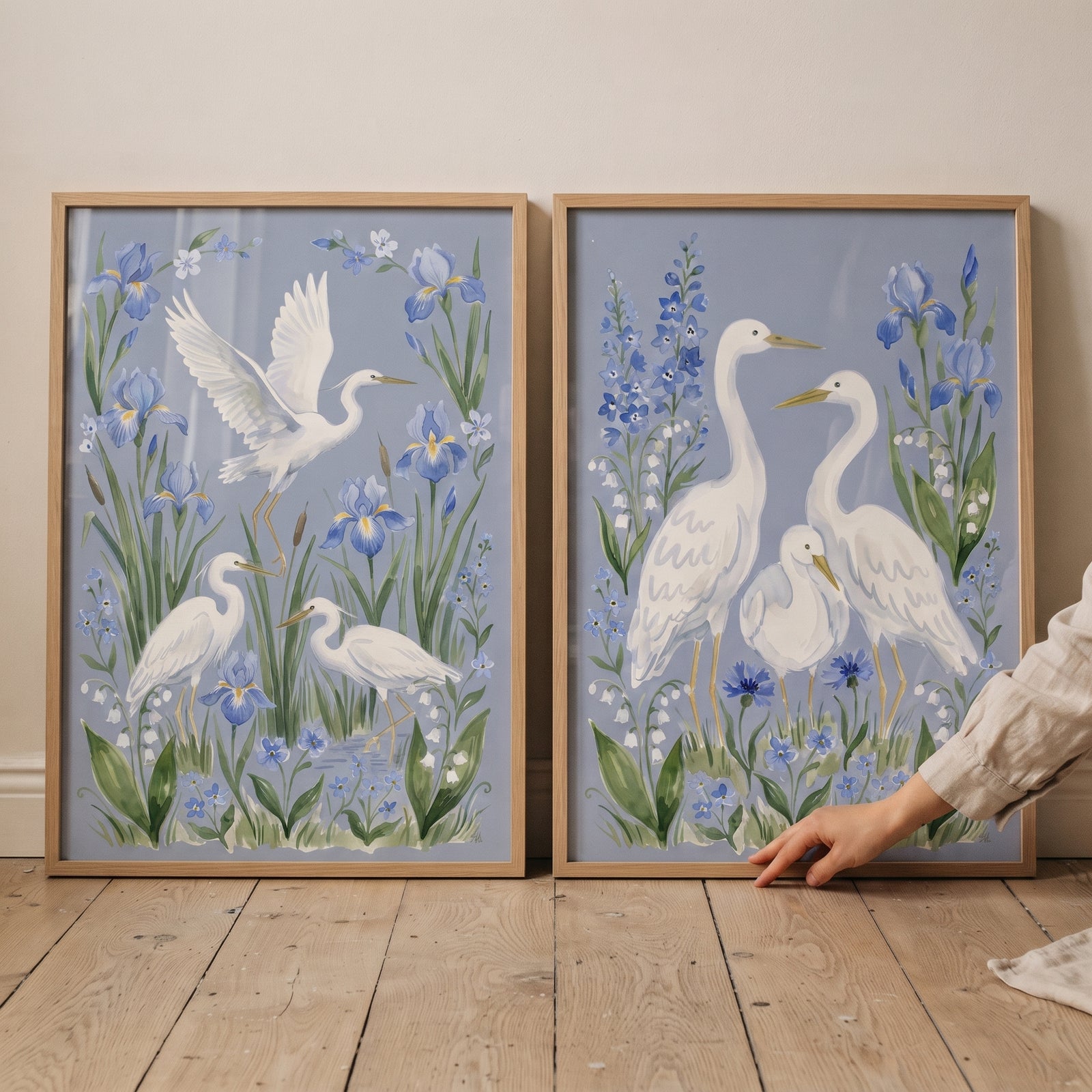 Coastal blue white heron bird print set of 2 in wood frames, featuring white birds among blue flowers.