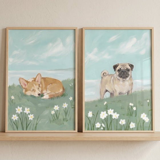 Coastal narcissus meadow dogs wall art set of 2 showing a corgi and pug in a field of white flowers under a light blue sky.