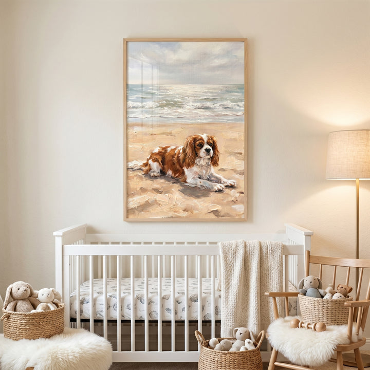 Coastal sandy beach cavalier dog wall art above a white crib in a cozy nursery with stuffed animals and a floor lamp.