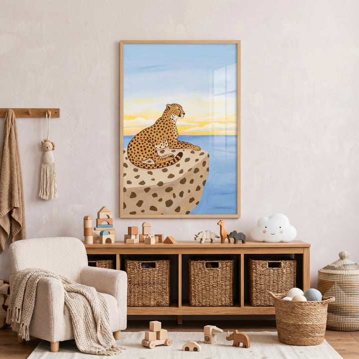 Coastal sunset sitting cheetah wall art hangs in a neutral nursery above a wooden toy shelf with wicker storage baskets.