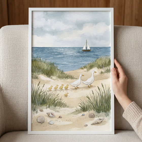 Coastal watercolor duck family wall art featuring ducks and ducklings on a sandy beach with seashells and a sailboat.