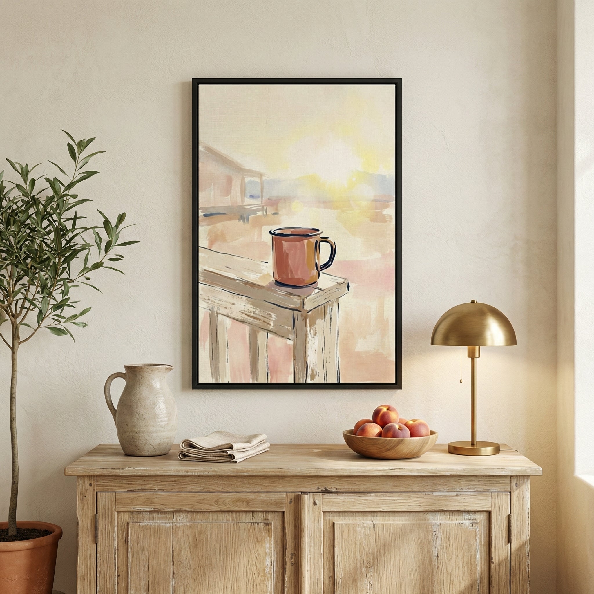Cozy interior with a framed artwork of a sunrise scene featuring a coffee mug on a porch railing, glowing in the morning light. The warm palette adds a serene, early-morning atmosphere.