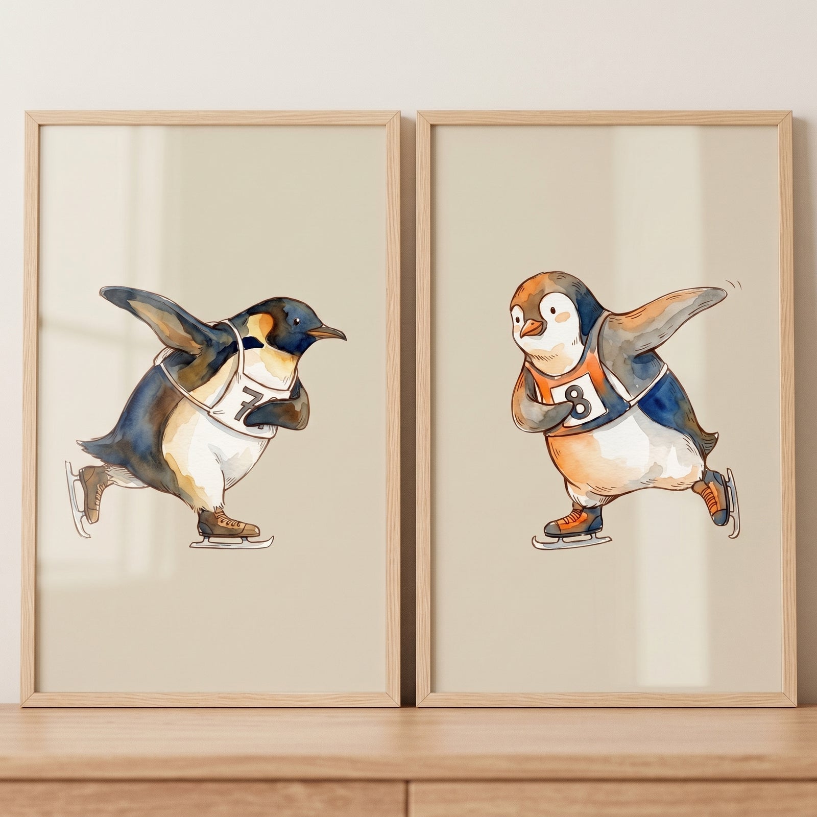 Competitive winter racing penguin wall art set of 2 features framed watercolor skating penguins wearing numbered bibs.