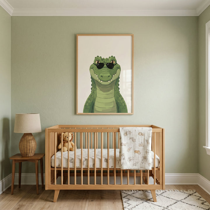 Cool sunglasses crocodile wall art hangs above a wooden crib in a green nursery with a lamp on a side table.