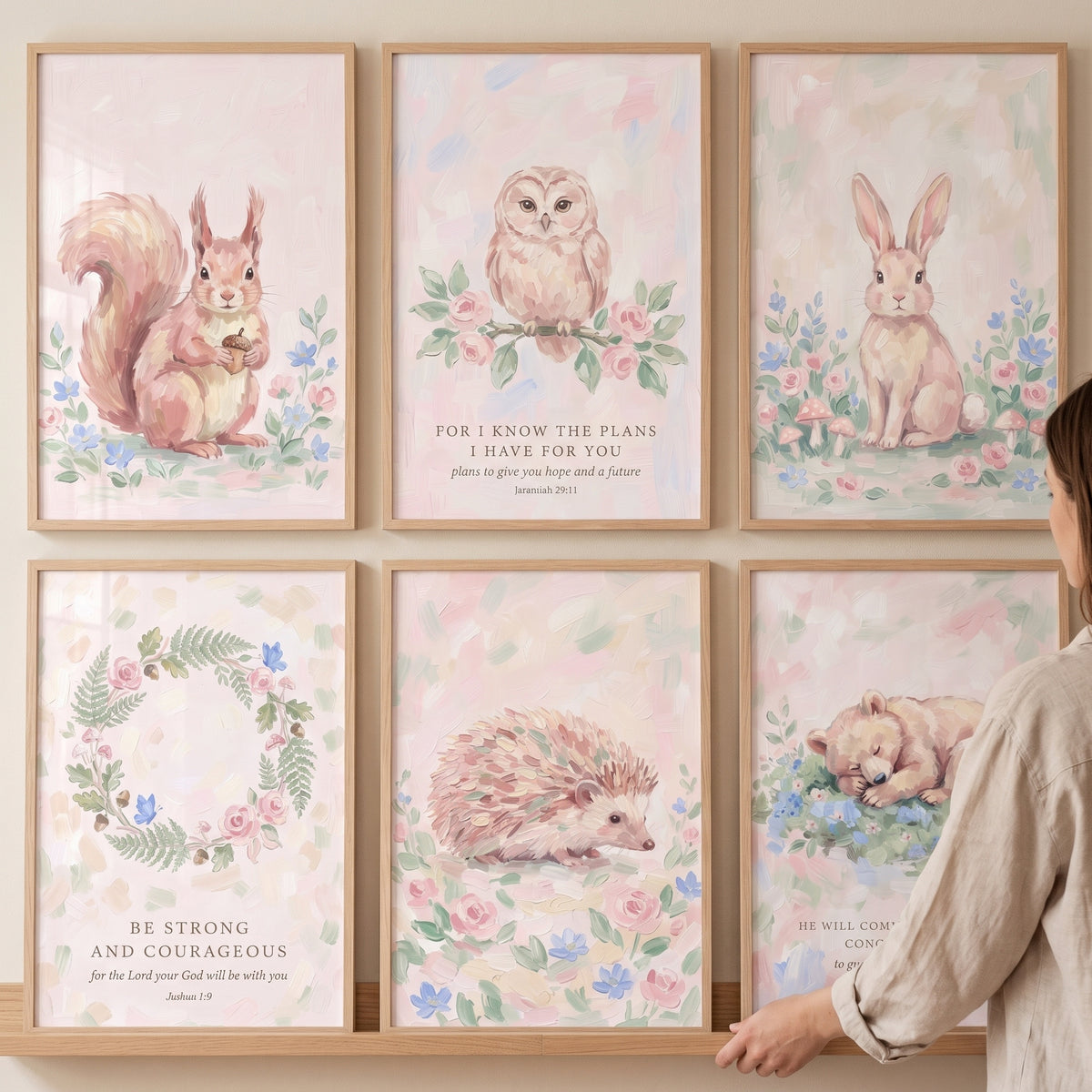 Coquette pink forest animals wall art set of 6 featuring a squirrel, owl, rabbit, hedgehog, bear cub, and floral wreath.
