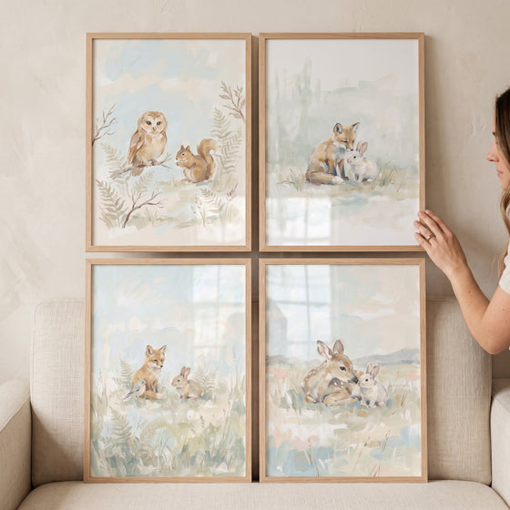 Cottagecore nursery woodland animals wall art set of 4 displays deer, foxes, bunnies, and an owl in light wood frames.