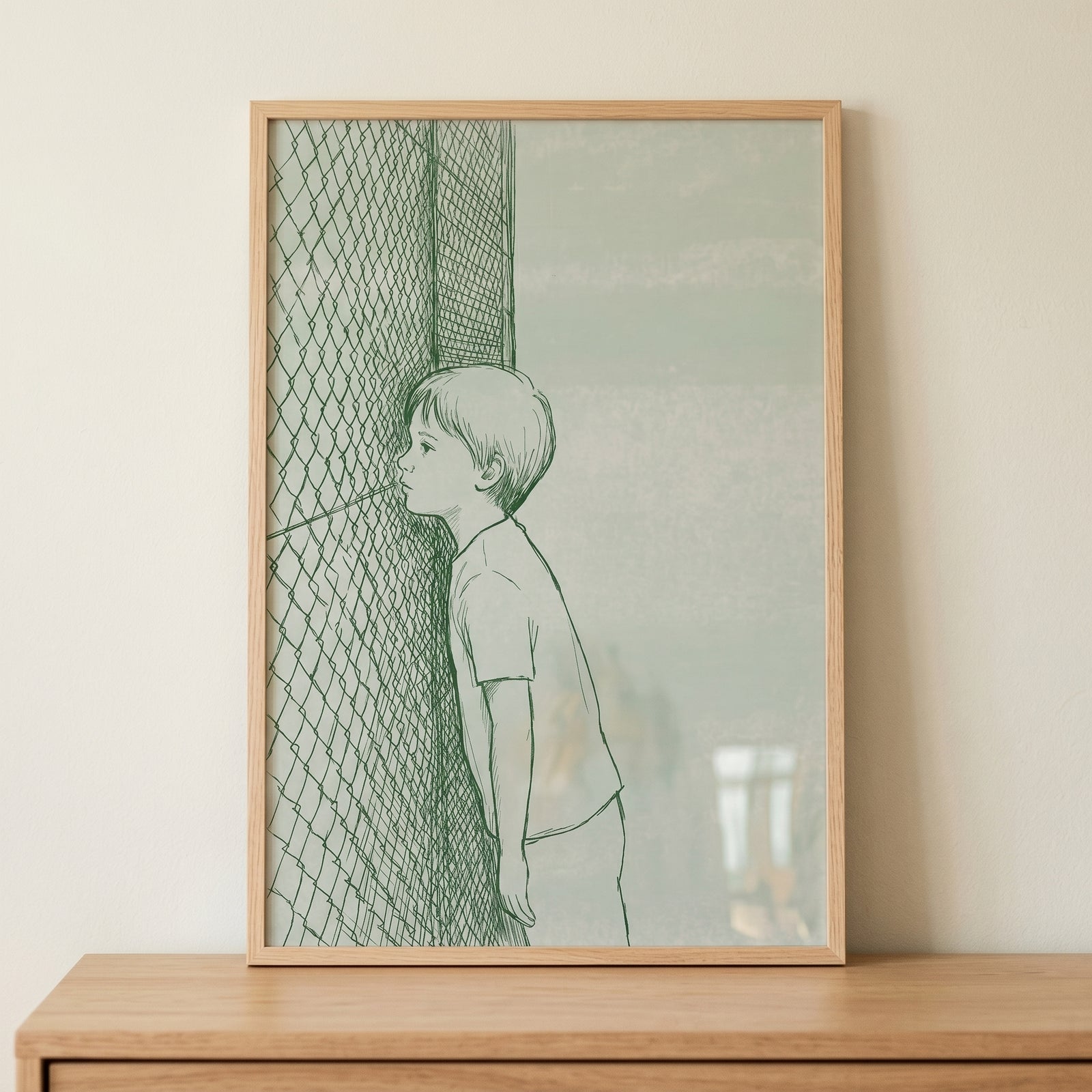 Framed courtside peeking boy wall art features a green line drawing of a child looking through a chain-link fence.