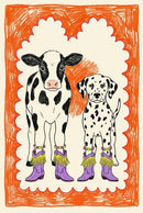 Playful illustration of a black-and-white cow and a Dalmatian dog standing side by side, both wearing matching purple boots with fringe and beaded anklets, framed in a bright orange border.