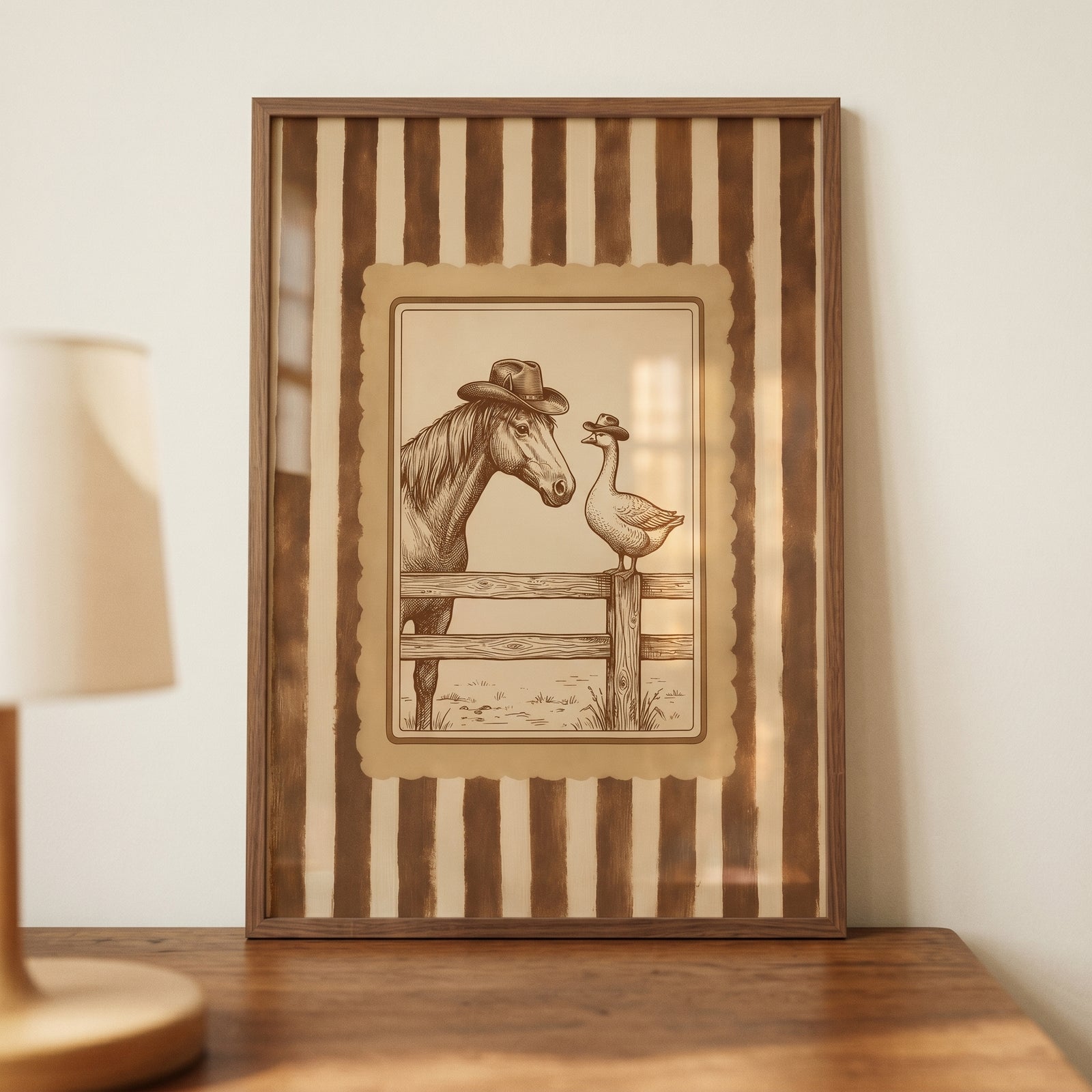 Framed sepia cowboy horse and goose wall art featuring a horse and goose wearing hats, set against a striped border.