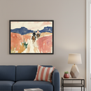 Modern living room with a blue sofa. A framed abstract painting depicts three figures on horseback riding through a desert landscape with blue mountains and coral-toned terrain. It hangs above the sofa.