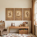 cream striped golfing animal print set of 3 with a fox, deer, and bear above a wooden play table with toys and a rug.