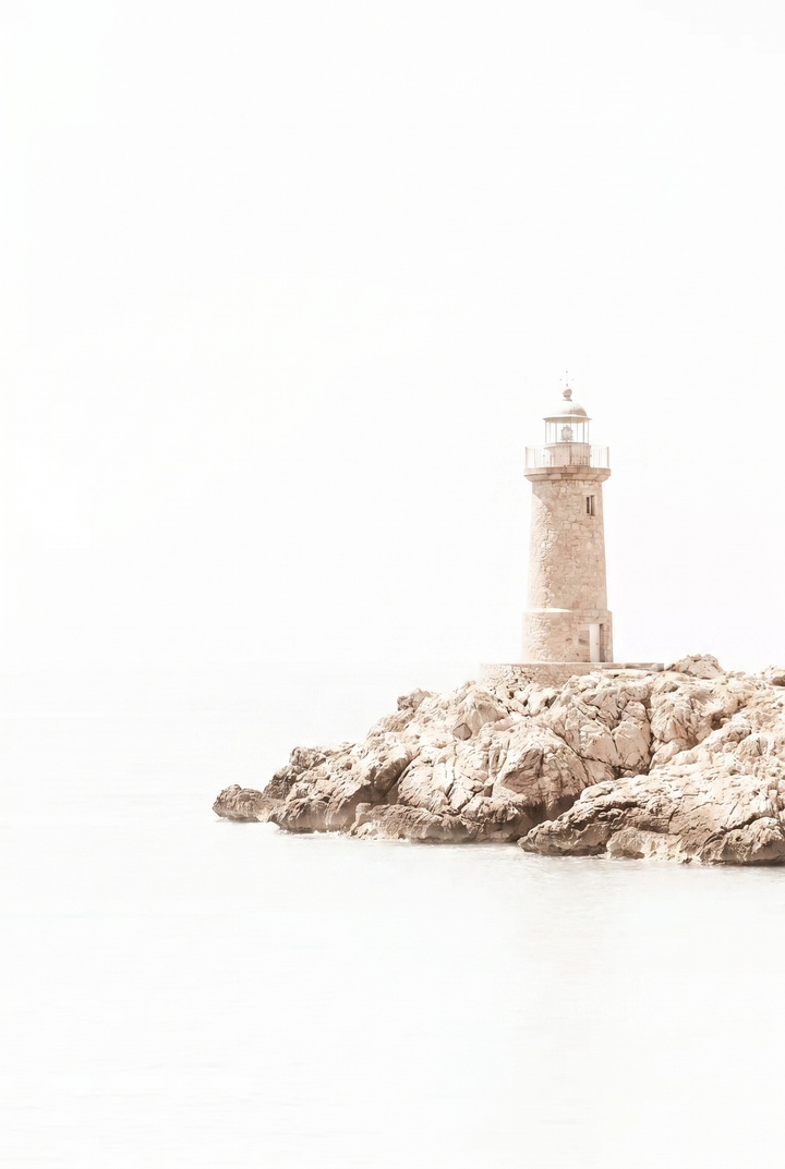 Creamy neutral coastal lighthouse wall art of a stone tower on a rocky outcrop against a minimalist white background.