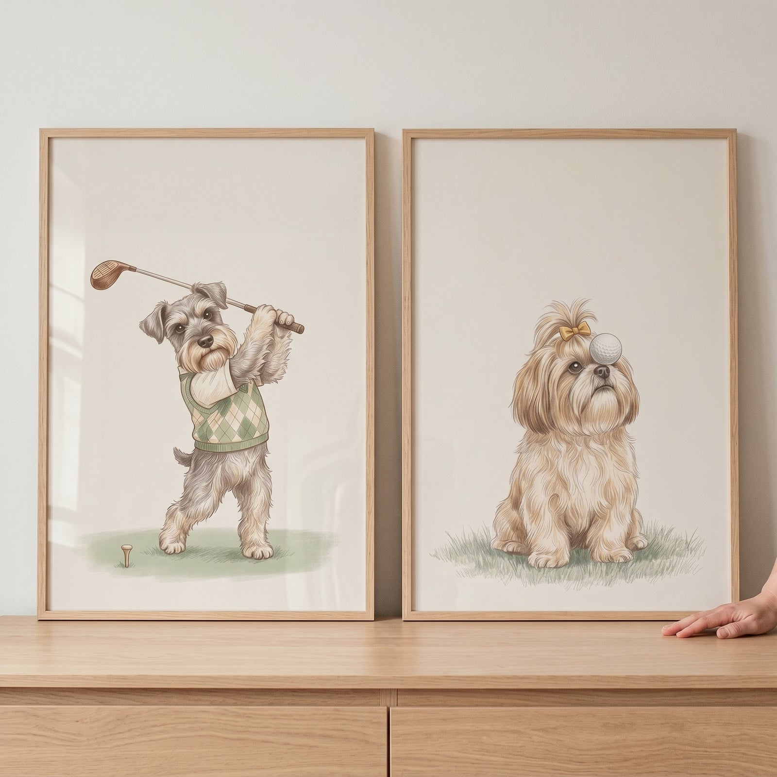 Creamy neutral golfing dogs wall art set of 2 shows a dog swinging a club and a fluffy dog balancing a ball on its head.