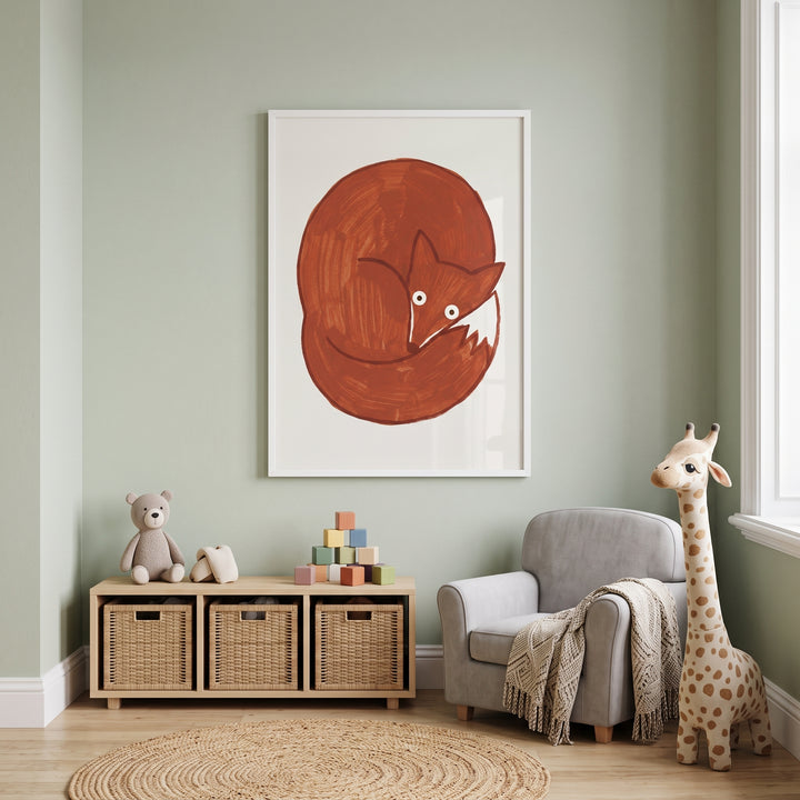 Curled up red fox wall art in a green room with a grey armchair, wicker baskets, and a tall stuffed giraffe.