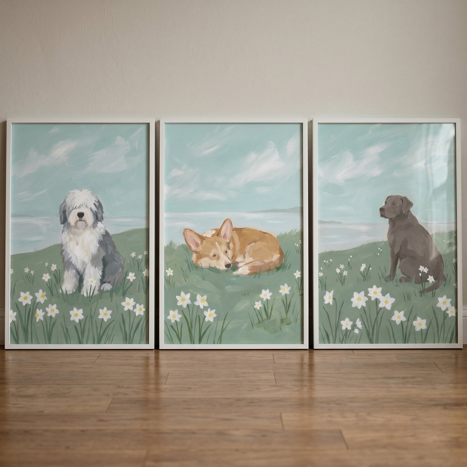 Three framed dog illustrations in a floral field. Daisy meadow spring dogs wall art set of 3.