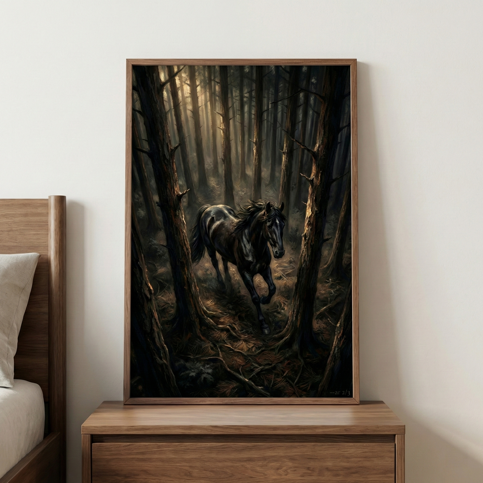 A framed piece of wall art depicts a majestic black horse galloping through a dark, atmospheric forest. Light filters through a dense canopy of tall trees, creating a dramatic backlighting effect. The horse is captured in mid-gallop, its dark coat and flowing mane detailed against the shadowy woods. The artwork is presented in a slim wooden frame, resting on a wooden dresser next to a bed, adding a sense of nature and power to the room's decor.