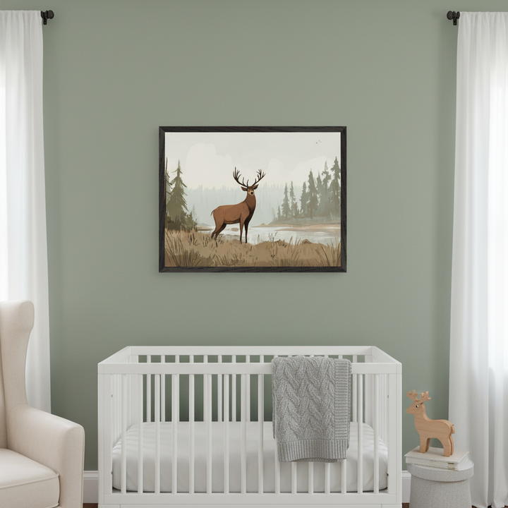 Modern nursery with sage green walls. A large framed print of an illustrative brown deer in a forest landscape hangs above a white crib with a grey blanket. A cream armchair is partially visible on the left.
