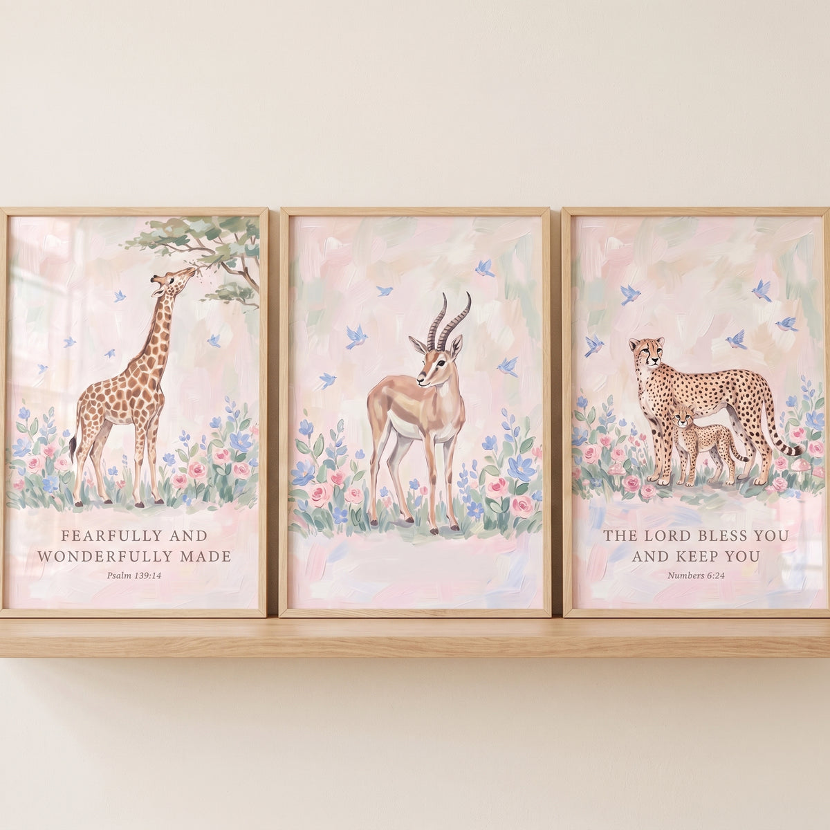 Delicate floral savanna animals wall art set of 3 featuring a giraffe, antelope, and cheetahs with Bible verses.
