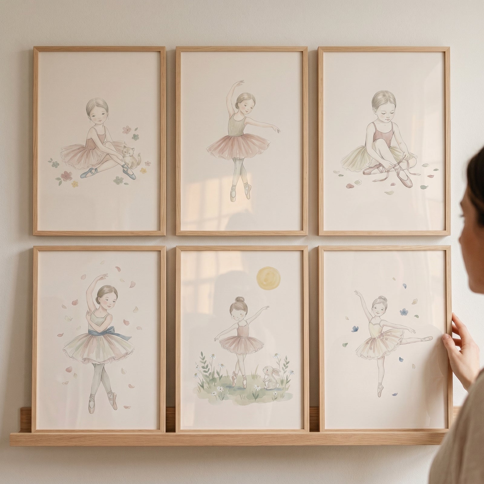 Delicate watercolor little ballerina wall art set of 6 framed and displayed on a wooden wall ledge.