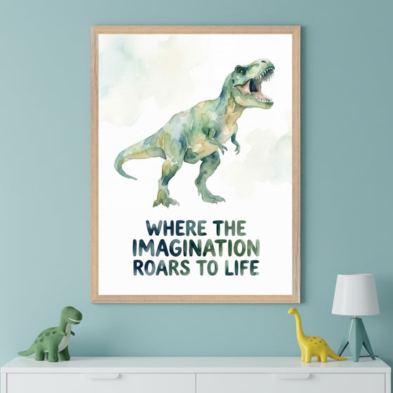 Kid's room with a light blue wall and white dresser. A large framed watercolor print of a roaring T-Rex with text "WHERE THE IMAGINATION ROARS TO LIFE" hangs above the dresser. A green stuffed dinosaur and a yellow plastic dinosaur with a lamp are on the dresser.