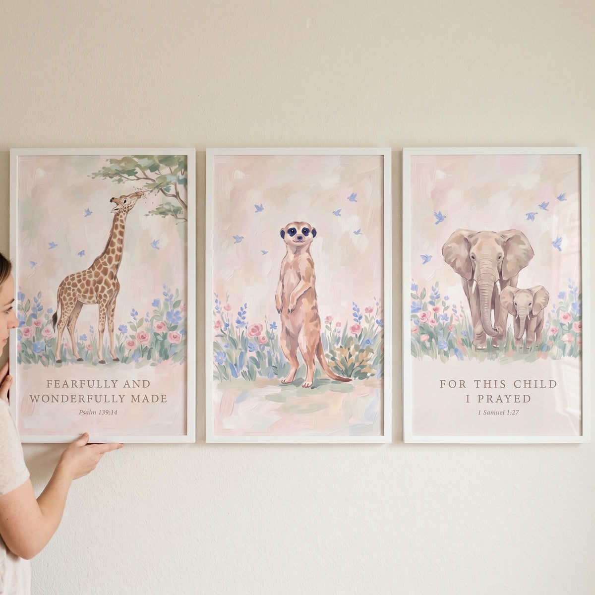 Divine meadow savanna animals wall art set of 3 featuring a giraffe, meerkat, and elephants in a soft floral landscape.