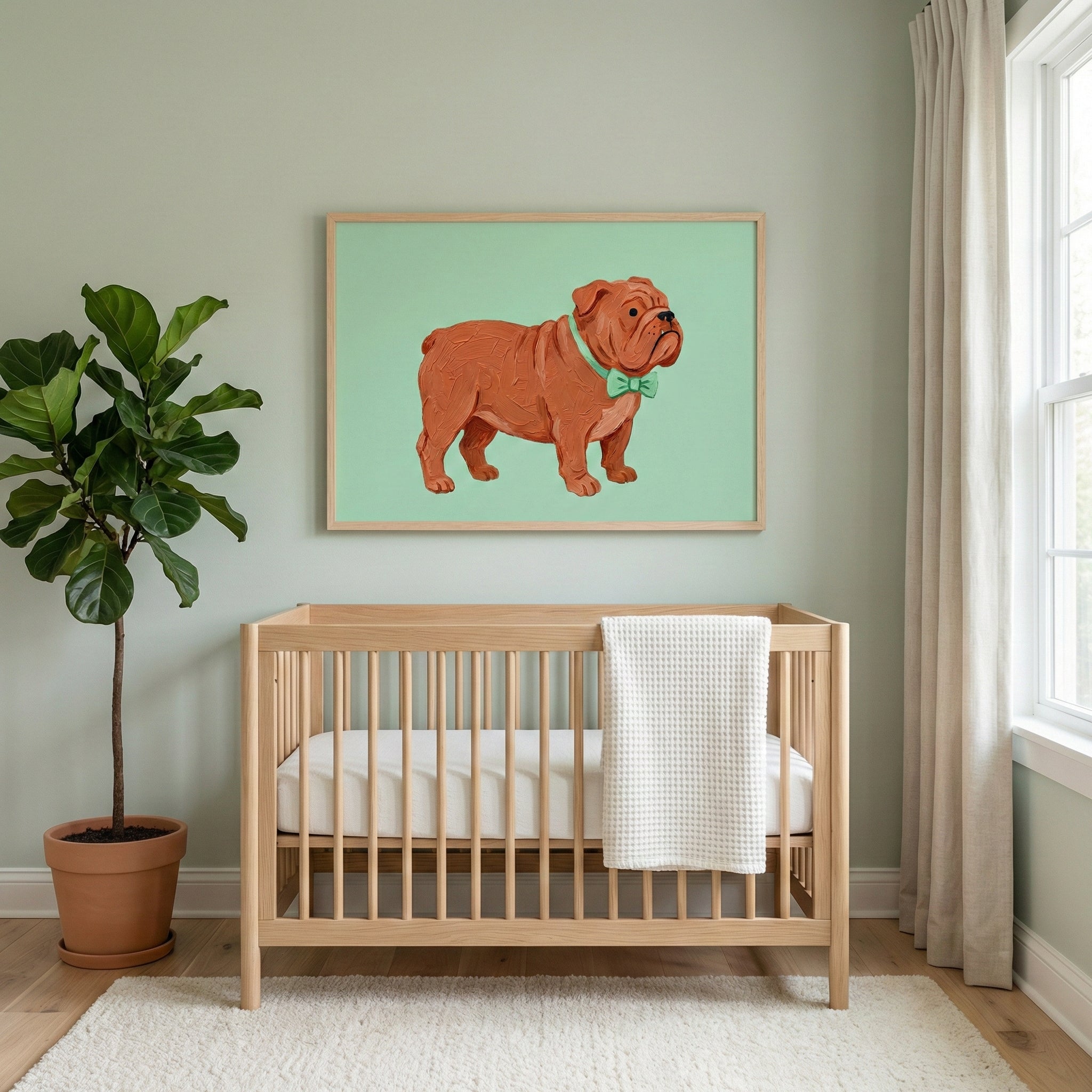 A framed painting of a brown bulldog in a green bow tie brings a playful, gender-neutral touch to a soft mint nursery. The artwork pairs warmly with natural wood tones and calming earth-inspired decor.