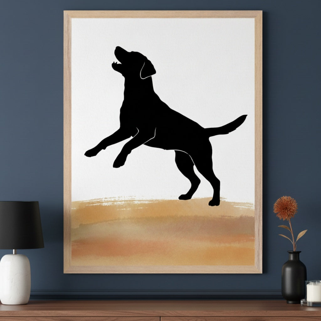 Modern room with a dark blue wall and a wooden dresser. A framed print of a black silhouette of a jumping dog on a white background with a brown and gold watercolor-style band hangs above the dresser. A black lamp and a small vase with a dried flower are on the dresser.